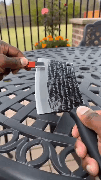 Handheld knife sharpener in use