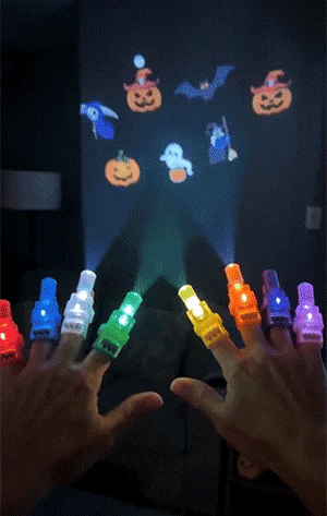 Halloween finger projector lights projecting colorful Halloween patterns
